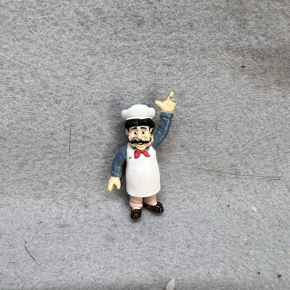 Tiny Chef Giving The "Finger"